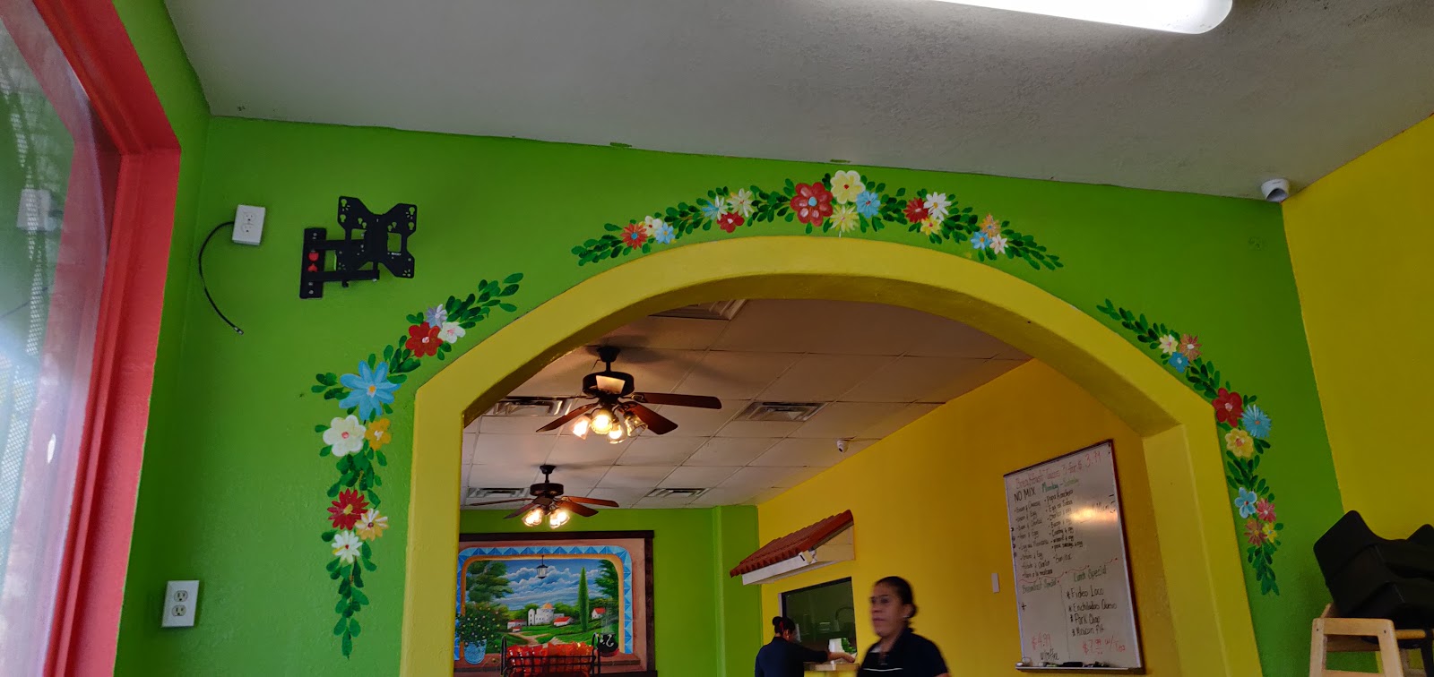 Hand-painted archway decor inside Mí Pueblito Mexican Restaurant