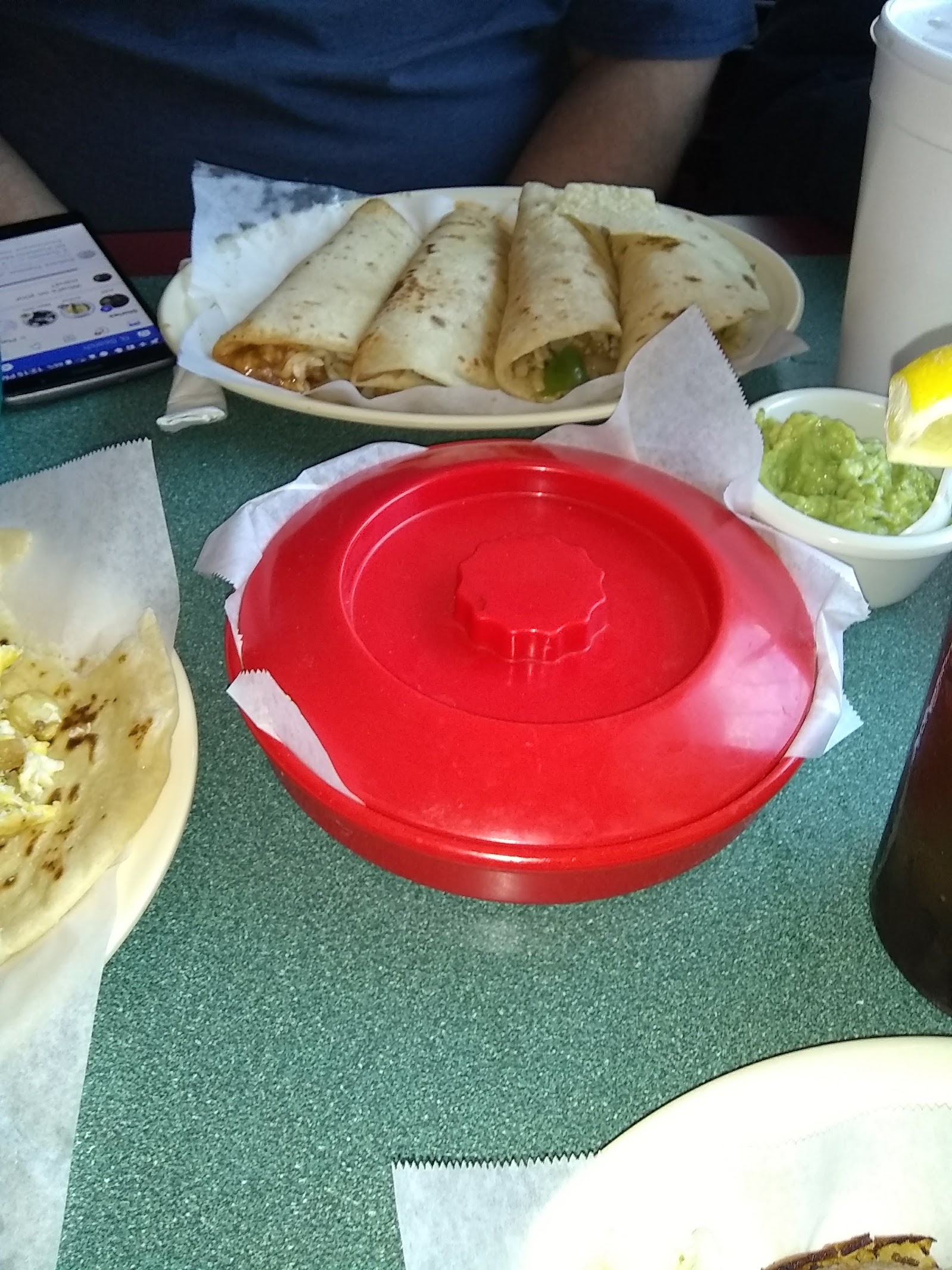 Tacos served with chips and guacamole at Mí Pueblito Mexican Restaurant